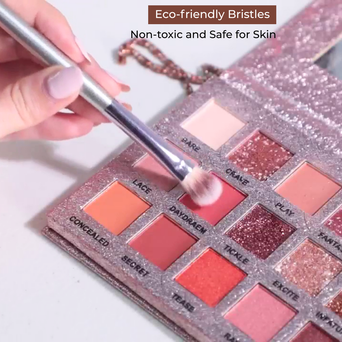Makeup brush applying makeup to a palette with text about eco-friendly bristles and safety.