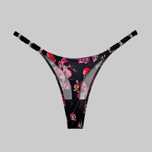 Floral-patterned thong on a white background