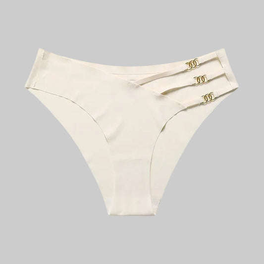 Set of beige women's underwear with gold accents on a white background