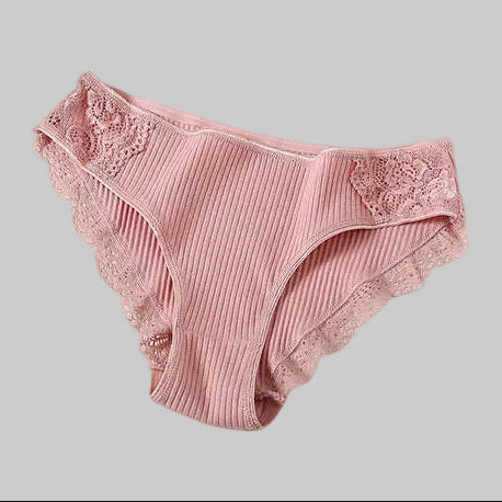 Pink ribbed underwear with lace trim on a light gray background