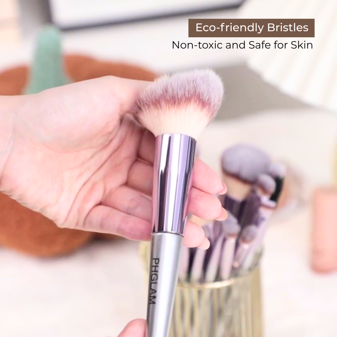 Makeup brush with eco-friendly bristles held by a hand, with text indicating safety and toxicity.
