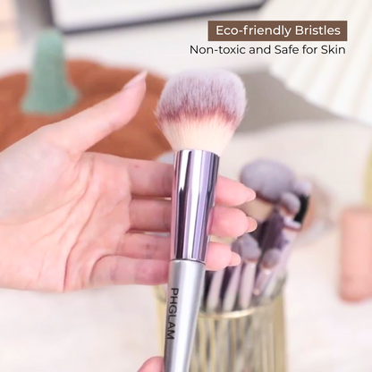 Makeup brush with eco-friendly bristles held by a hand, with text indicating safety and toxicity.