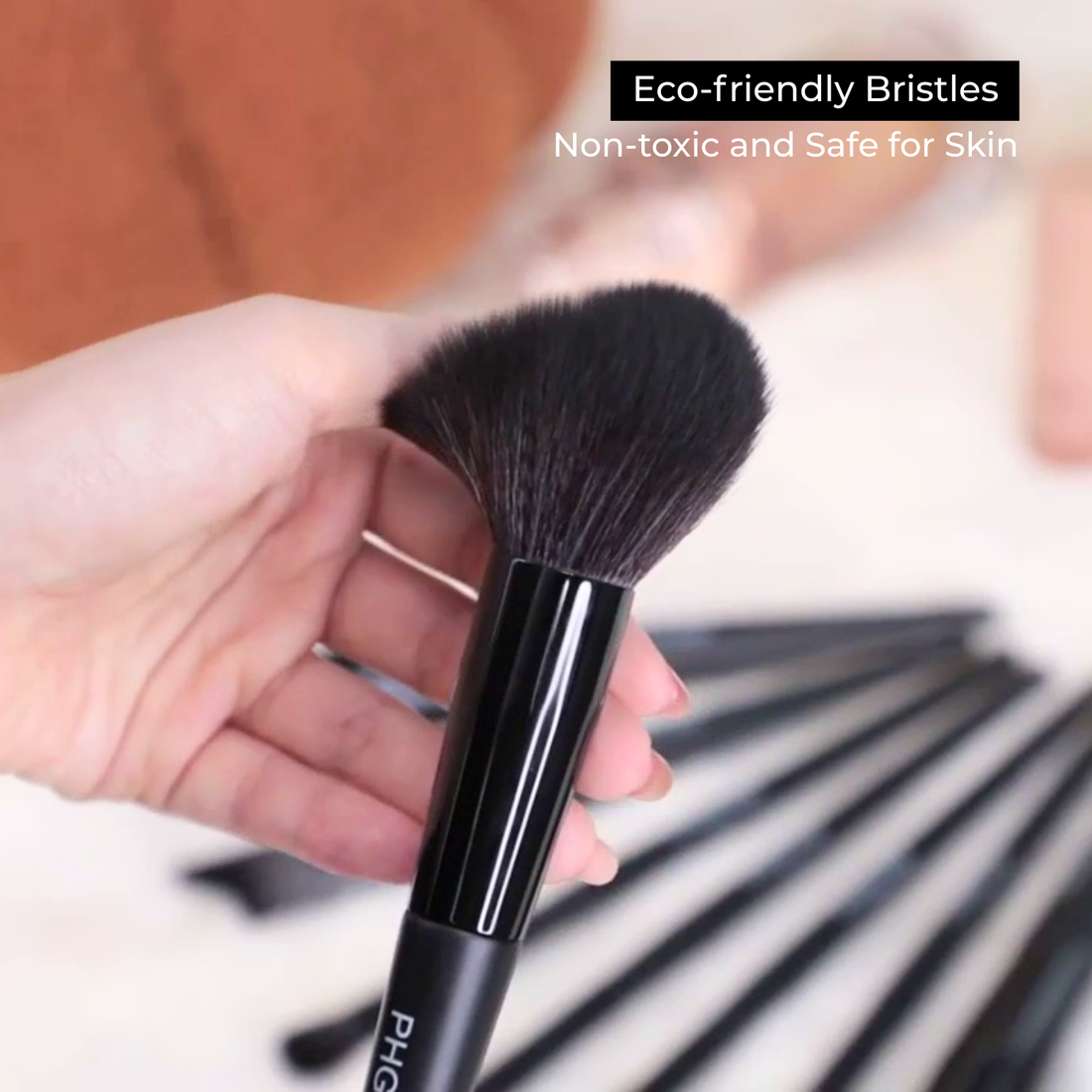 Makeup brush with eco-friendly bristles held by a hand, with text about safety and toxicity.
